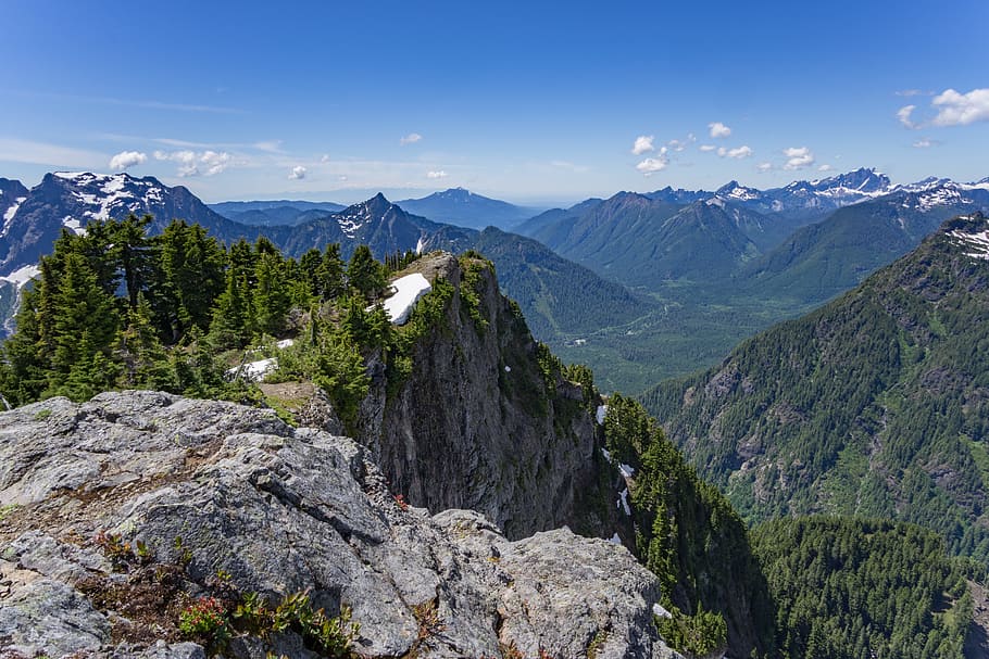 green and brown mountain under white and blue sky, gray and green mountain during daytime HD wallpaper