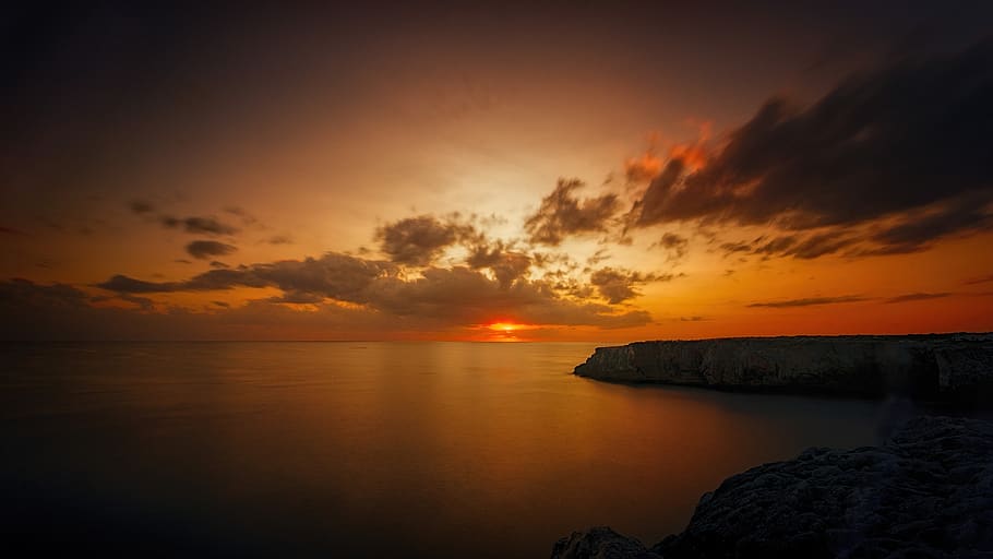 sunset, dawn, dusk, ocean, rock, clouds, bank, waters, evening HD wallpaper