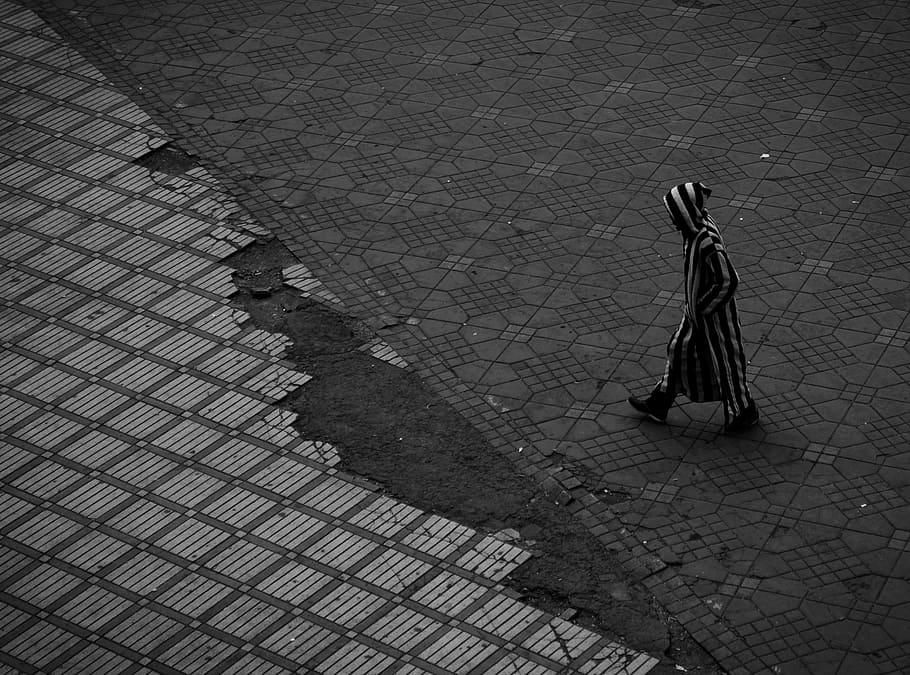 photo of man wearing black and white striped clothes walking HD wallpaper