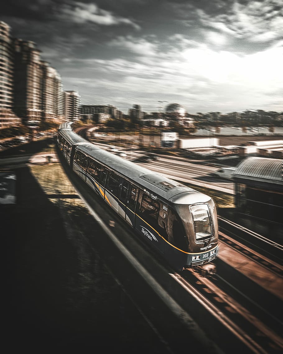train running on railroad during daytime timelapse photography, gray and black train moving HD wallpaper
