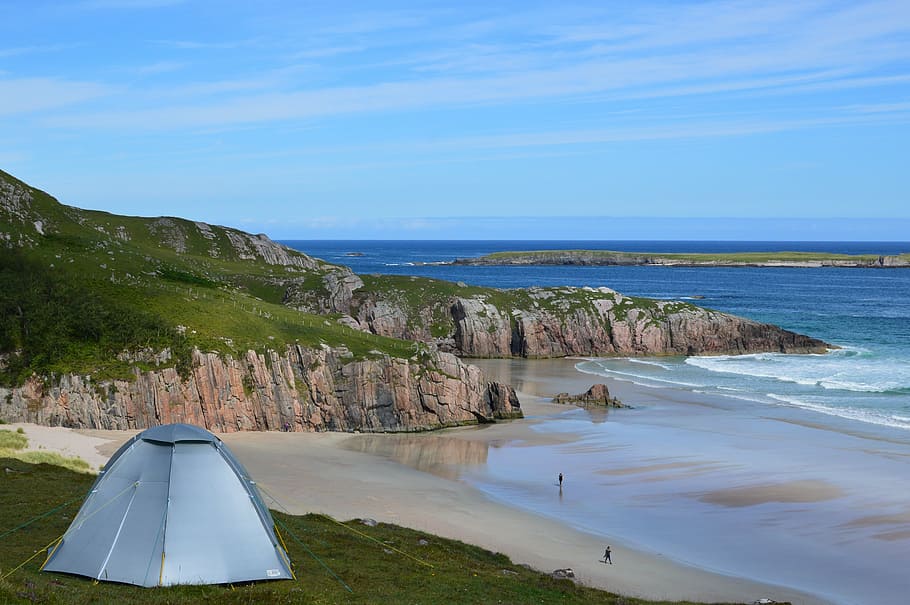 gray dome tent on green grass near sea, scotland, camping, beach
