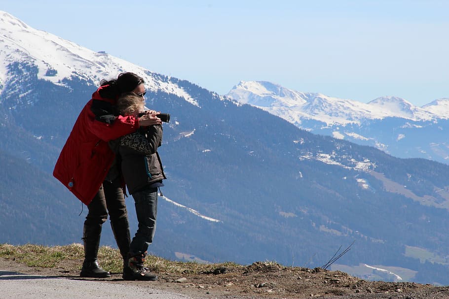 person hugging another person near cliff, binoculars, alpine HD wallpaper
