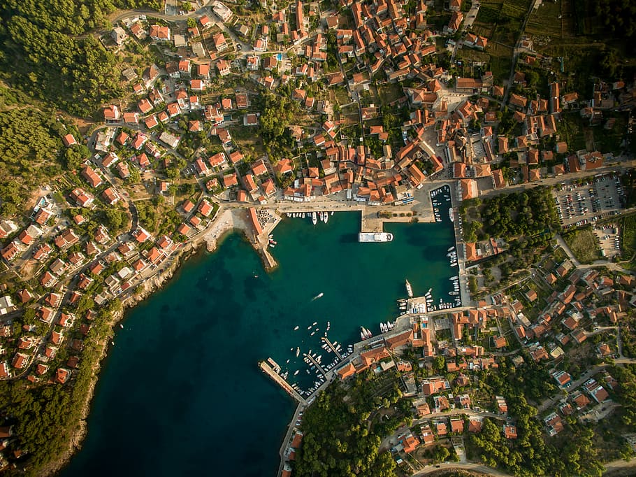aerial photo of body of water and buildings at daytime, Arial photography of village