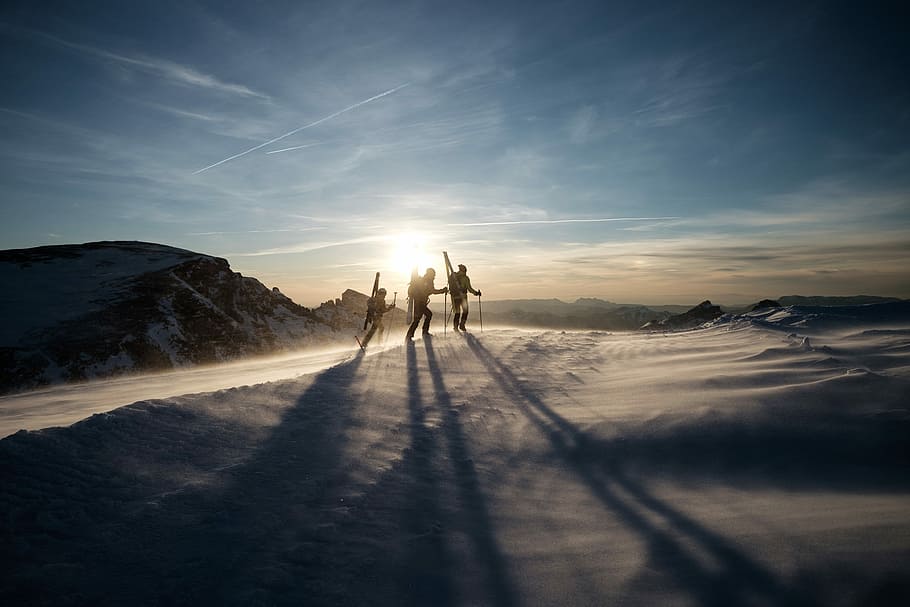 three people walking on snow-capped mountain during daytime, three person walking on snow HD wallpaper