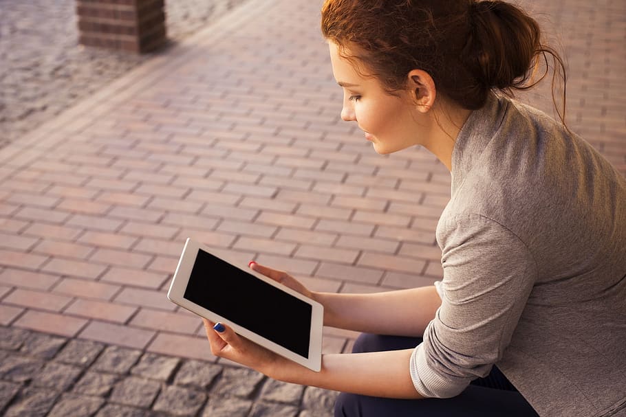 woman holding white tablet computer, reading, technology, wireless HD wallpaper