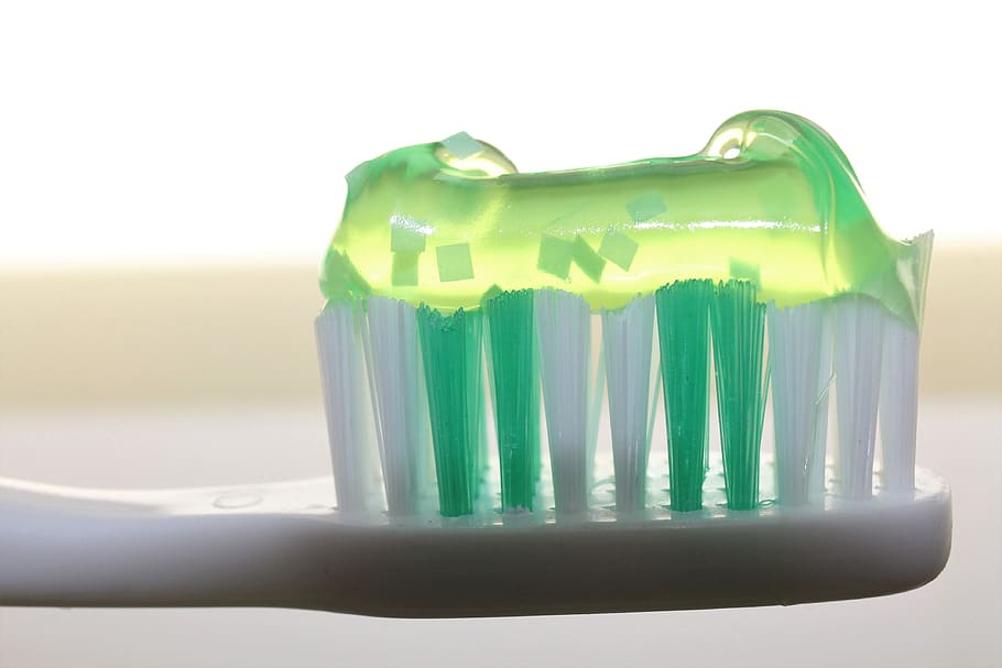 toothpaste on toothbrush, dentistry, oral, luminous green, bristles, HD wallpaper