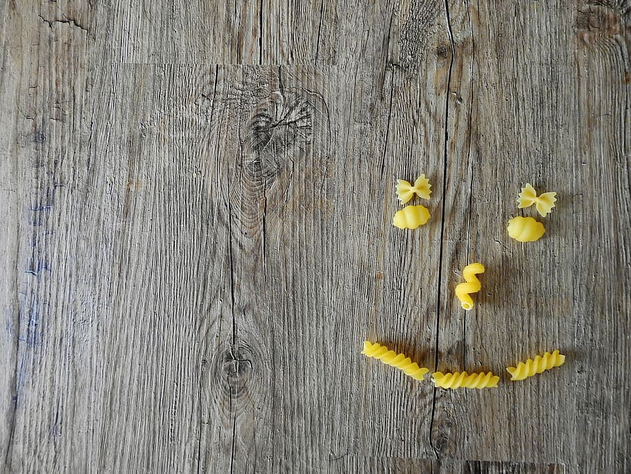 pasta forming face on brown wooden panel, eat, cook, dine, kitchen HD wallpaper