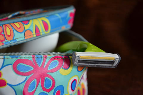 opened bag with shaver, cosmetics, bathroom, machine, disposable razor HD wallpaper