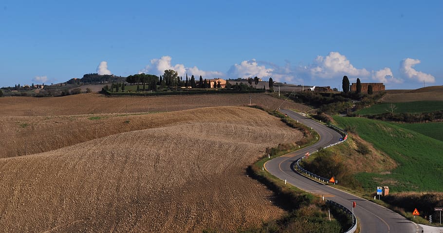 aerial photography of road near field, val d'arbia, siena, tuscany