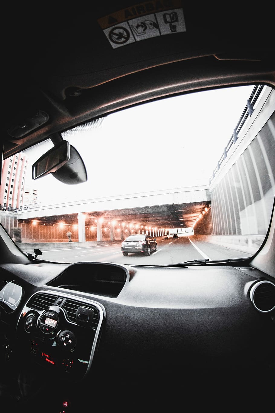 person inside vehicle talking photo of road near building, black vehicle dashboard with a view of tunnel HD wallpaper