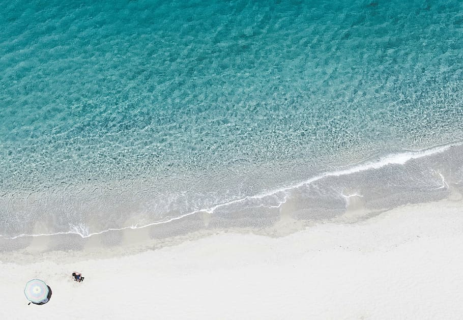 aerial photography of person on shore near umbrella, body, water HD wallpaper