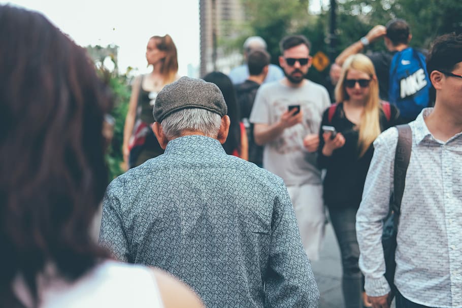 man wearing teal collard shirt walking through couple of people, shallow focus photography of man walking outdoors, HD wallpaper