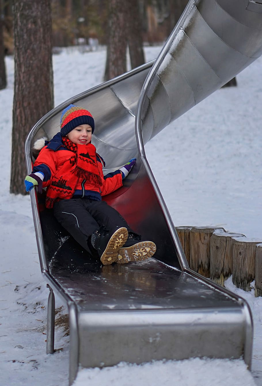boy sliding on silver slide, playground, walk with the children