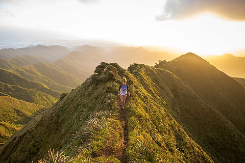 woman walking on pathway on top of hill at golden hour, woman walking on mountain trail HD wallpaper