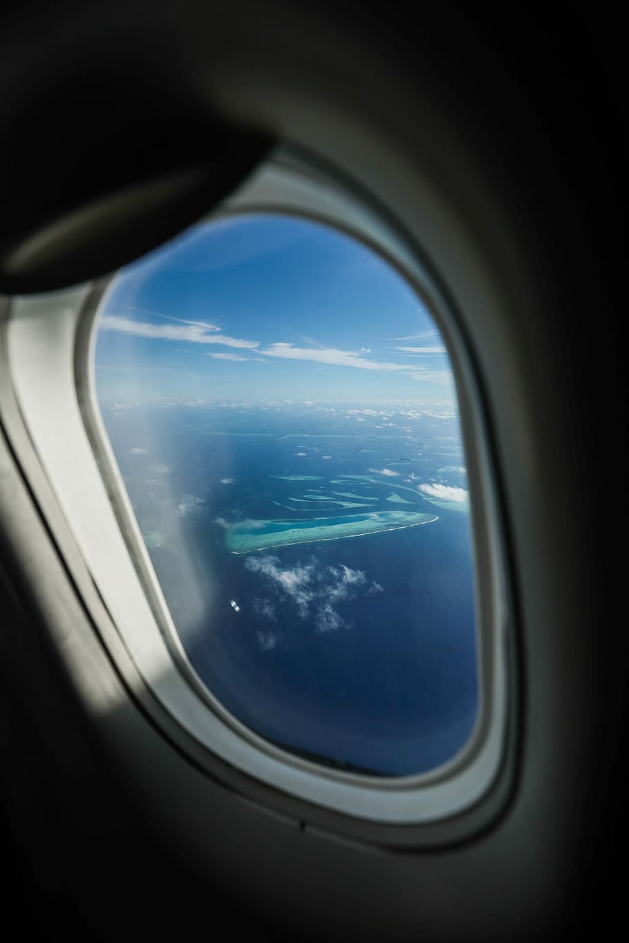 photo of green island, aerial shot of body of water, window, plane HD wallpaper