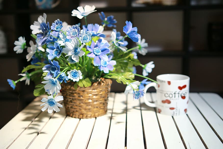 white and red coffee-printed ceramic mug near flower decor HD wallpaper