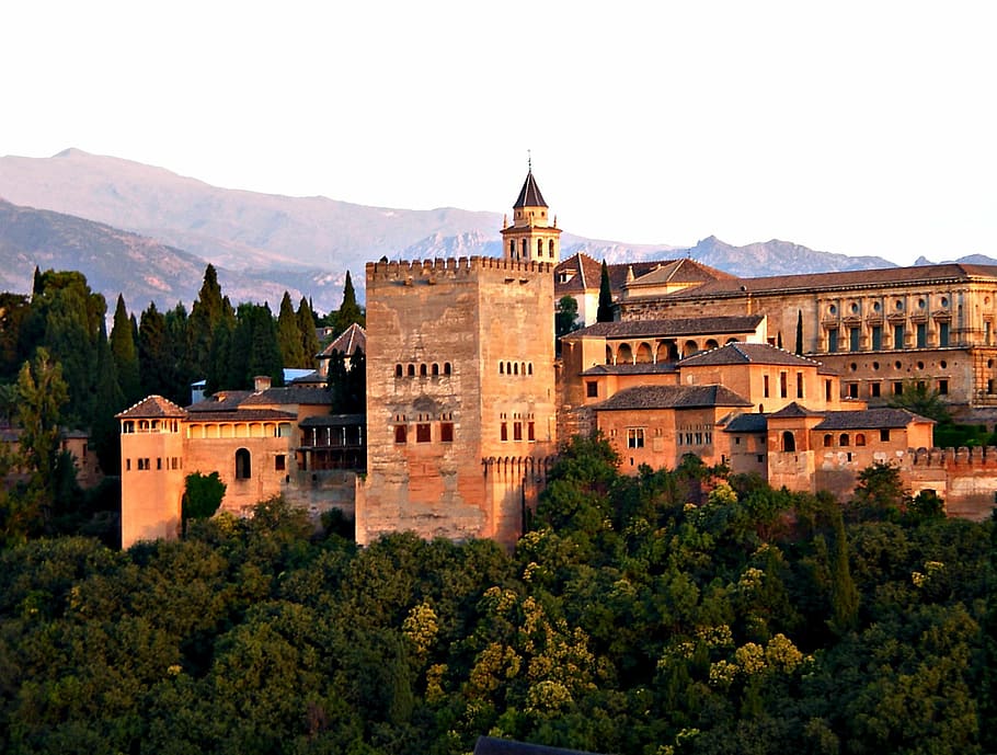 brown building surrounded by trees, alhambra, granada, spain
