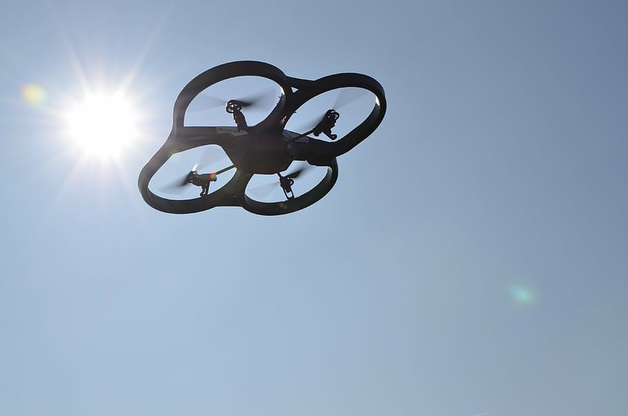 black quadcopter drone, uav, sky, sun, low angle view, sunlight HD wallpaper