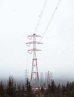 red electric tower surrounded by trees, electricity pylon during daytime HD wallpaper