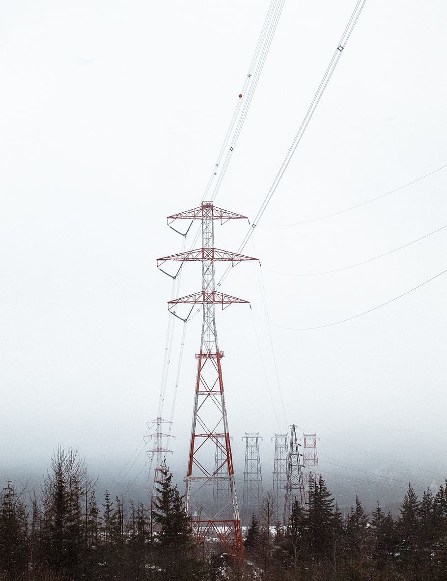 red electric tower surrounded by trees, electricity pylon during daytime HD wallpaper
