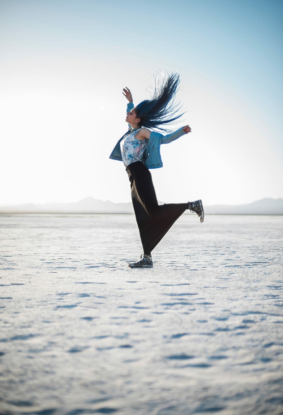 the moment of freedom, woman lifting left leg on ice surface HD wallpaper