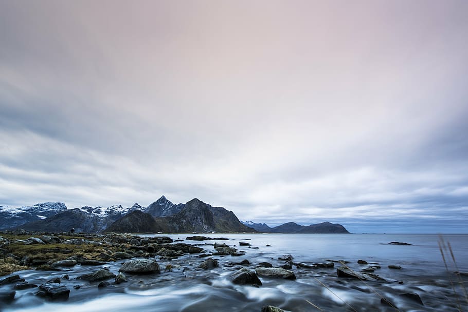 mountain near body of water, lofted islands, dawn, rocks, sky HD wallpaper