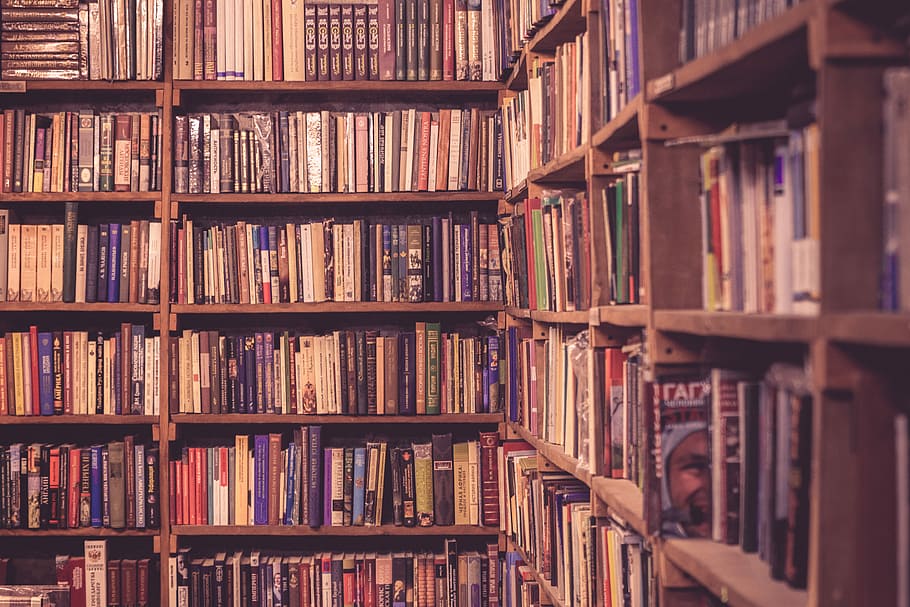 brown wooden bookcases filled with books, pile of assorted-title books on bookshelf HD wallpaper