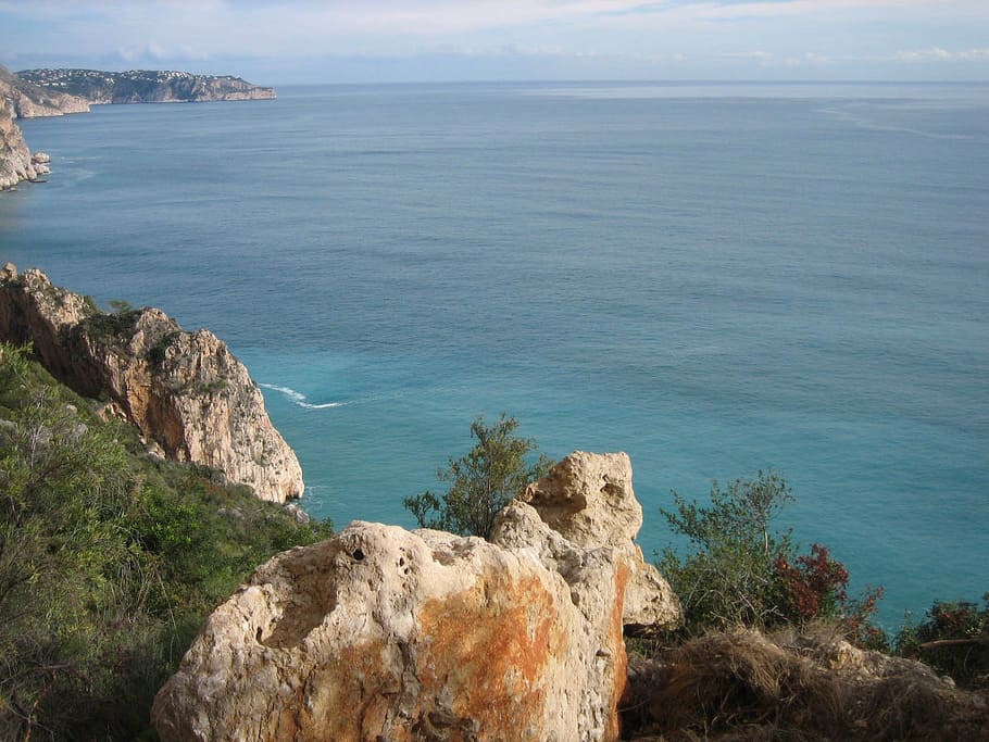 sea, rock, water, surface, outlook, stone, bank, nature, spain HD wallpaper