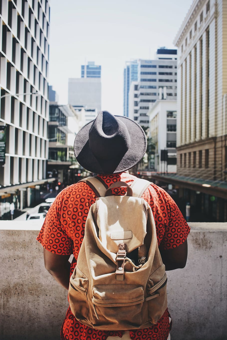 man on top of bridge looking on road below, people, bag, hat HD wallpaper