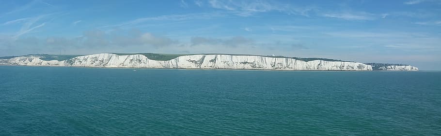panoramic photo of ocean and island, chalk cliffs, dover, coast