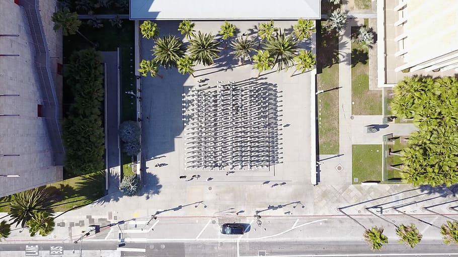 aerial view of open space, aerial photography of people walking near building HD wallpaper