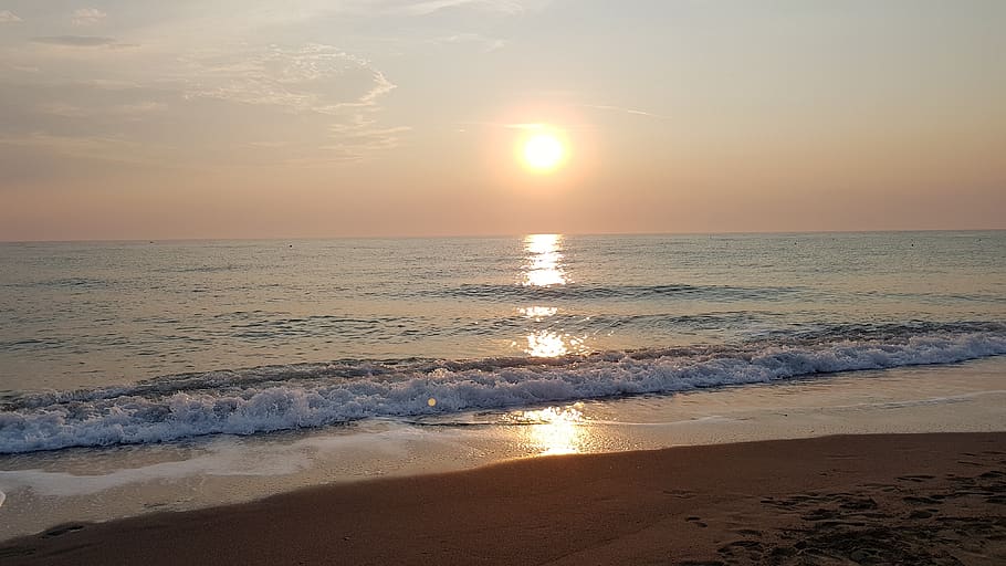 sea, sunset, beach, light, water, sky, land, horizon over water HD wallpaper