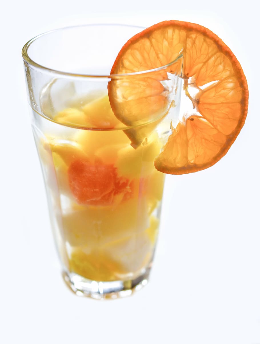 fruit juice in clear pint glass with slice orange, drink, fruits