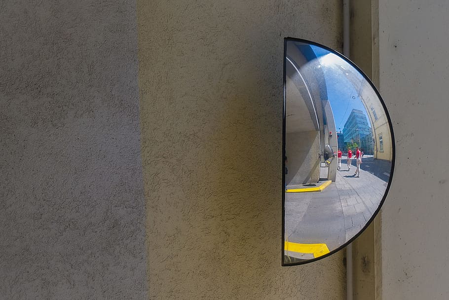 Close-up street shot of a half-mirror, image captured in Linz, Austria HD wallpaper