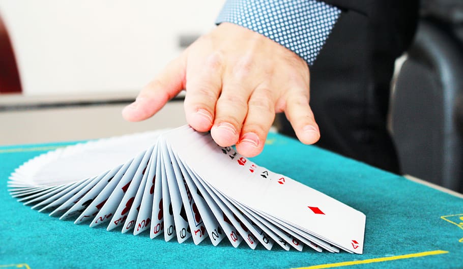 person hands on top of playing cards, magic, magician, attention HD wallpaper