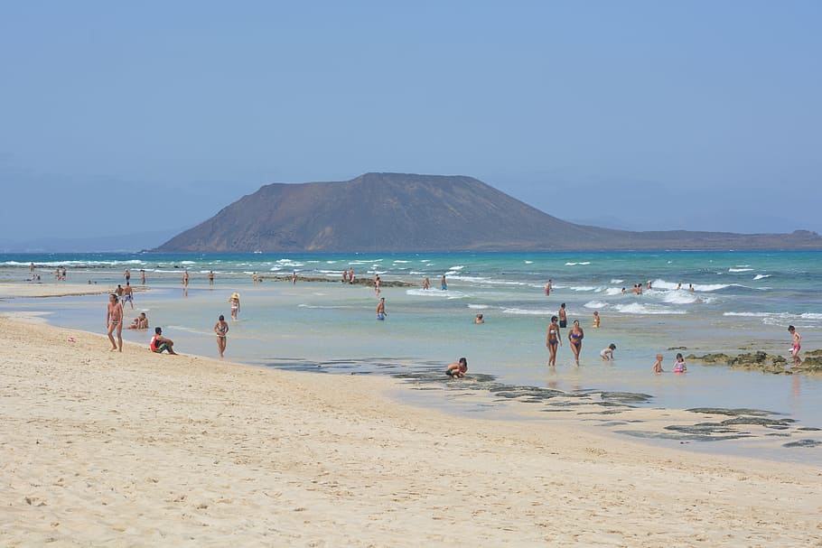 people on beach during daytime, isla de lobos, island, fuerteventura