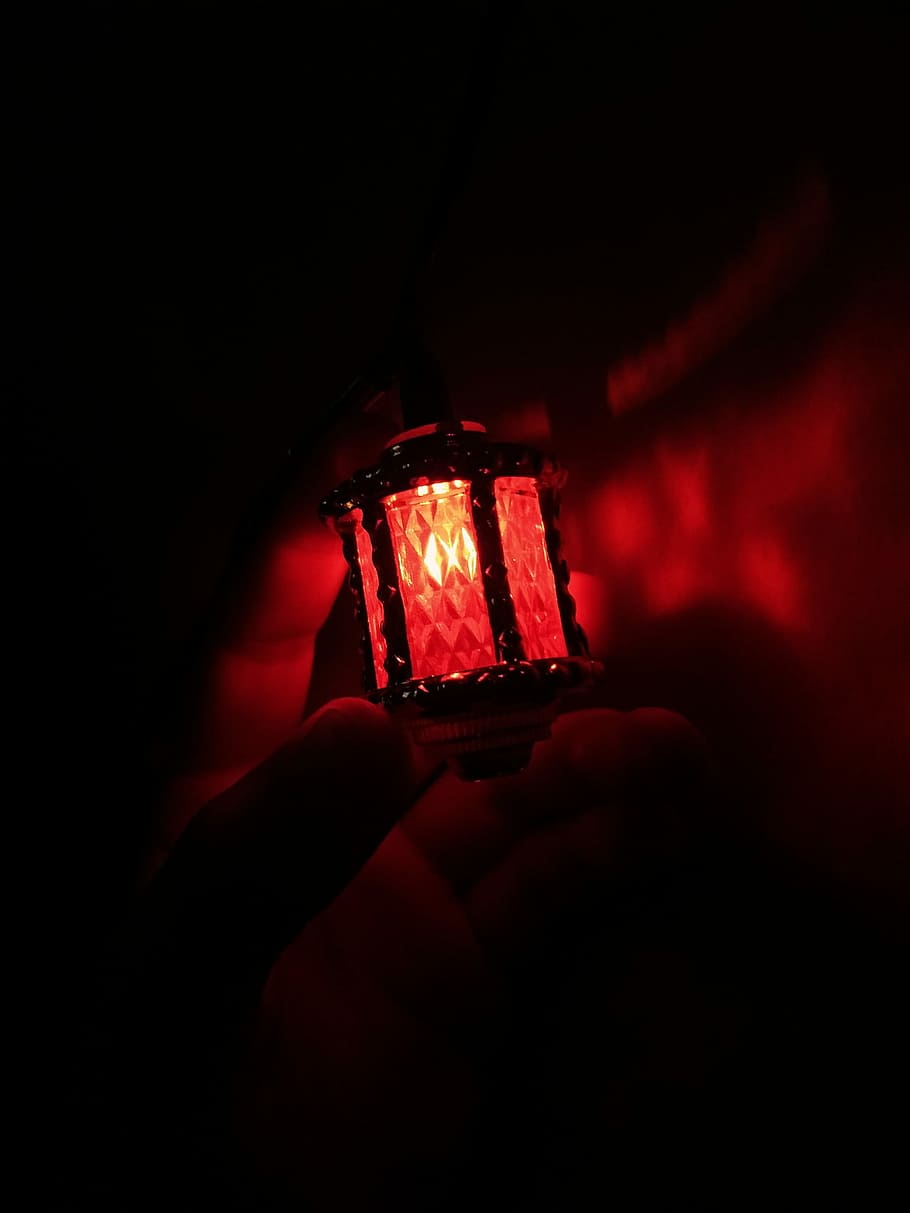 person holding red light, person holding red lamp, illuminated HD wallpaper
