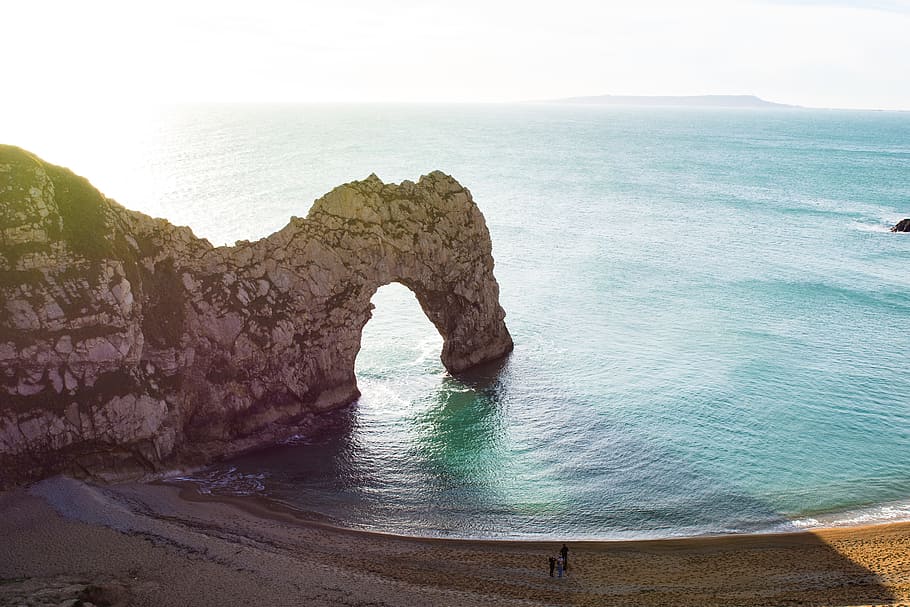 aerial view of beach with arch rock formation, rock formation on body of water, HD wallpaper