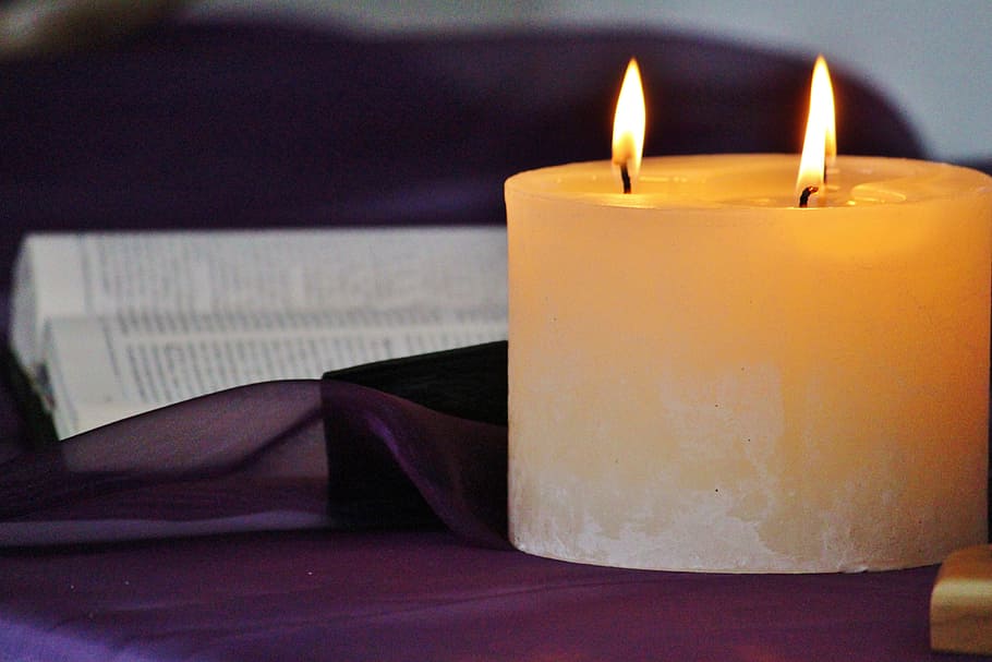 litted pillar candle on table, wick, cozy, prayer, bible, fire HD wallpaper