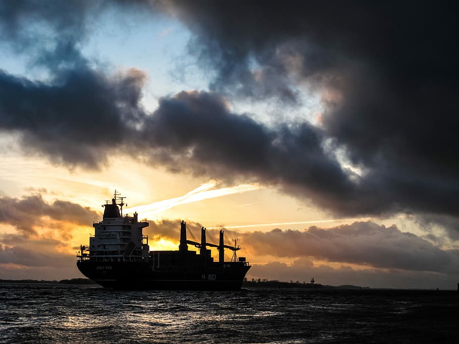 ship sailing during sunset, ship on body of water under cloudy sky HD wallpaper