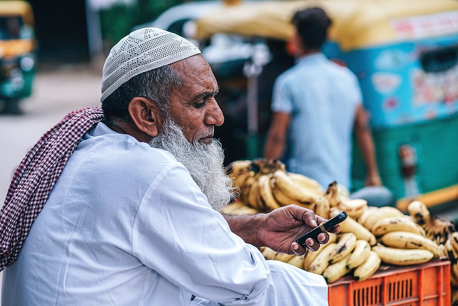 man using black phone, background, bananas, beautiful, bright HD wallpaper