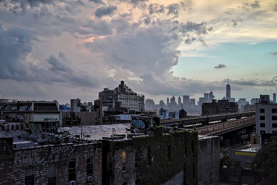 photo of black concrete building under white clouds at noontime, photo of cityscape HD wallpaper