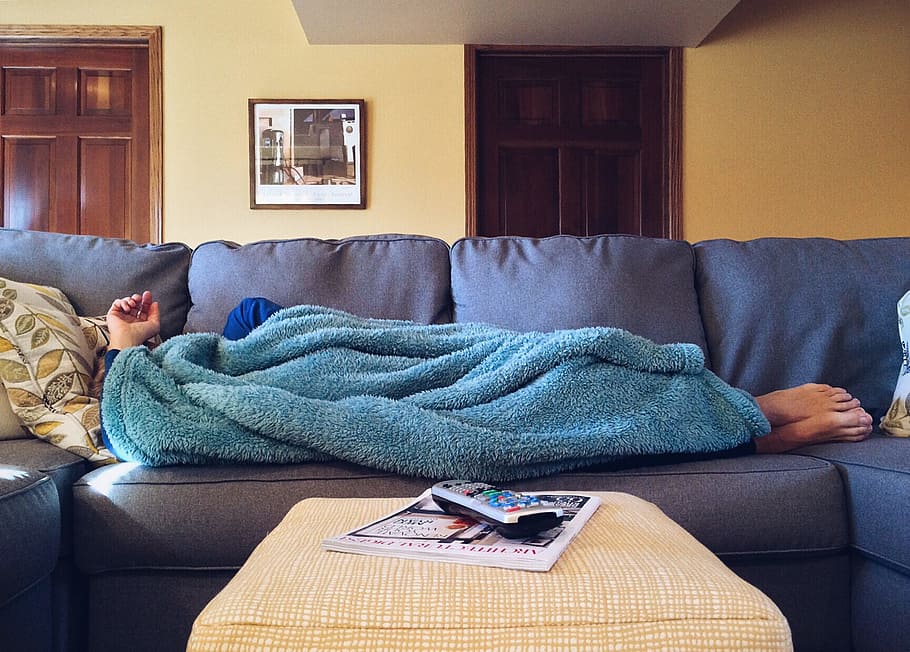 person lying on bed with blue fleece textile, home, life, sofa HD wallpaper