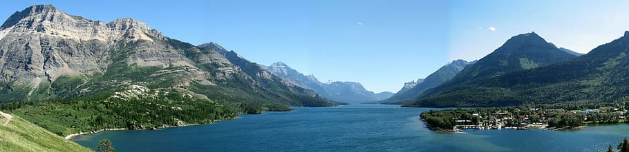 Mountains, shoreline, and lake landscape in Waterton lakes national park panorama