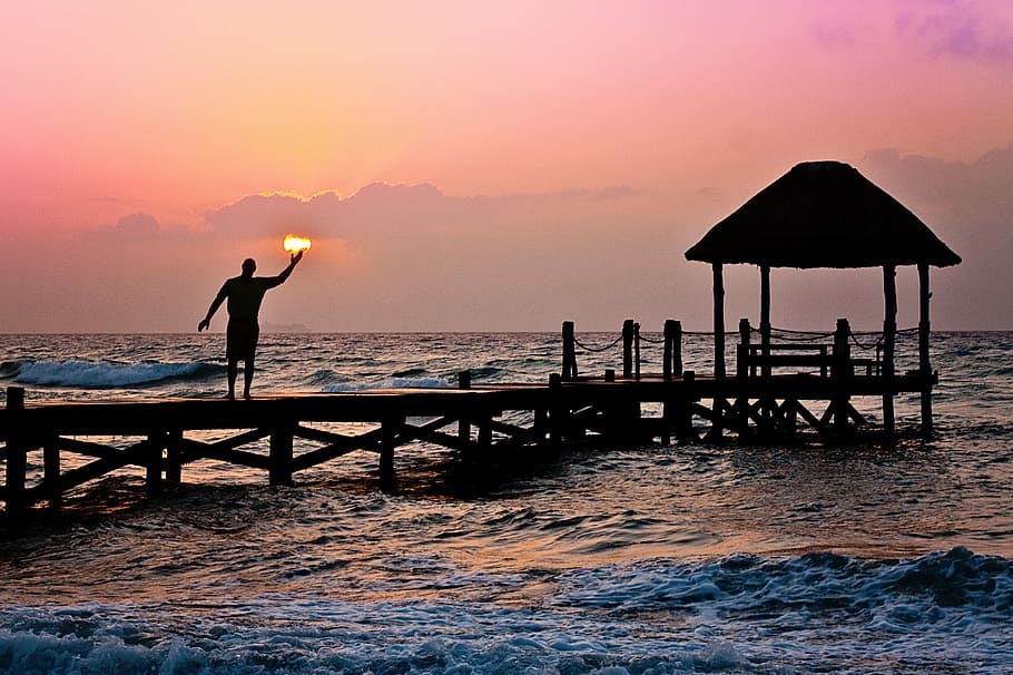 photo of man on dock during golden hour, sun, holding, ocean HD wallpaper