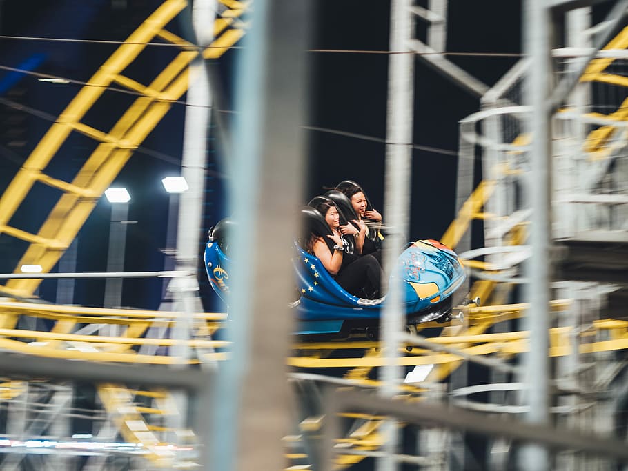 man and woman on roller coaster, two person riding roller coaster ride