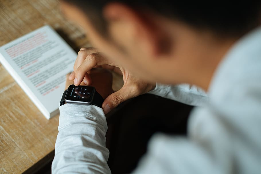 man sitting in front of table, smart watch, apple, technology HD wallpaper