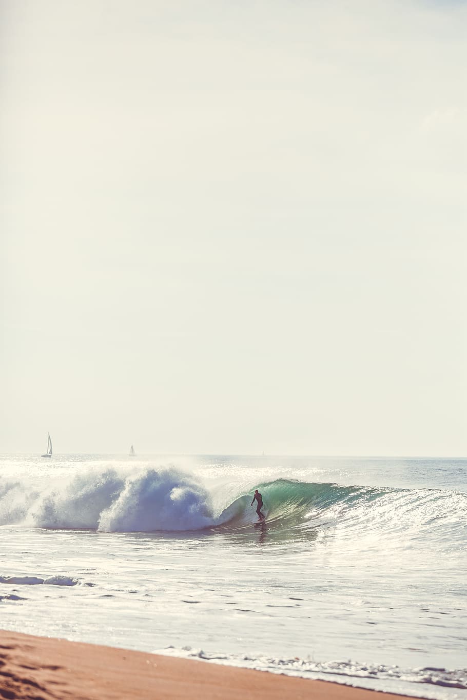 person surfing near seashore, person playing surf during daytime HD wallpaper