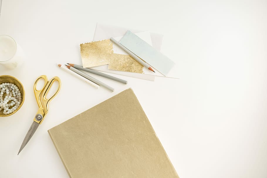 yellow handled scissors beside brown paper, yellow shears near paper on white surface, HD wallpaper