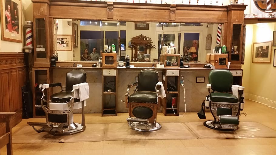 three barber's chairs near the mirror, barbershop, old time, indoors